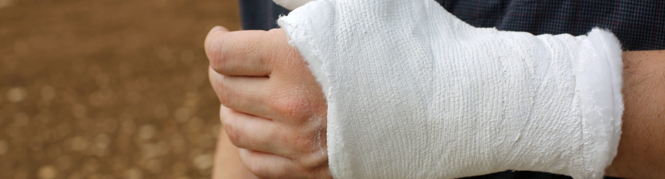 Man with bandage on his hand after accident ready to make a RIDOOR report