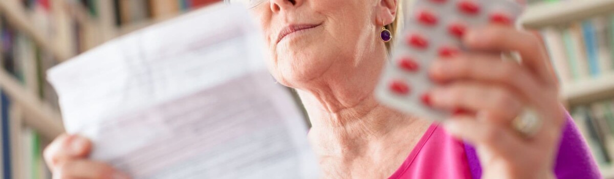 Woman with mental health problems looking at her medication instructions