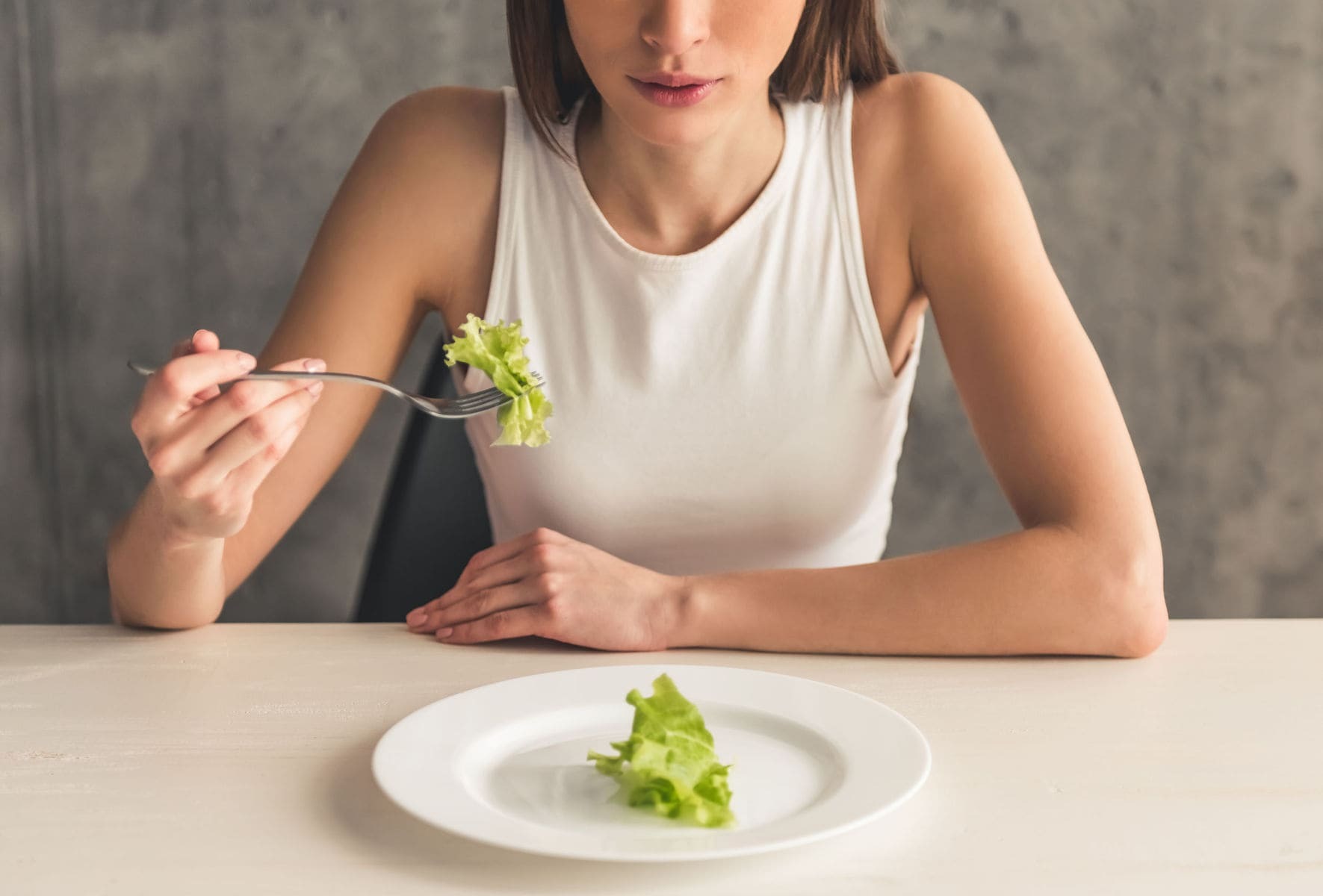 Woman struggling with eating disorder