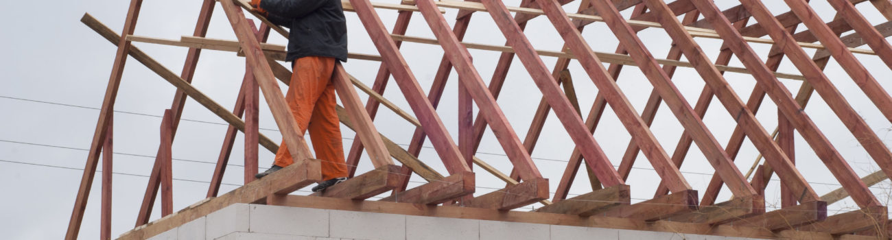 builder working on a roof