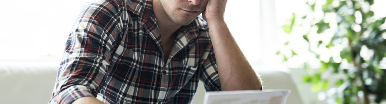 Men's Mental Health - Man struggling with financial worries