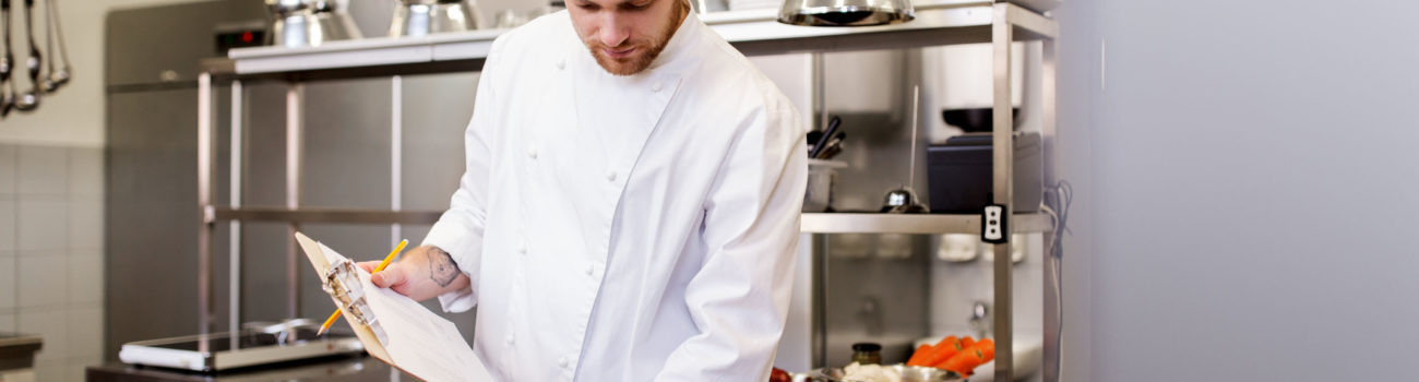 Chef working in a busy kitchen using FIFO method to find ingredients