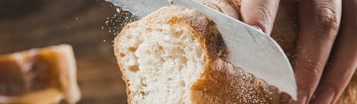 Loaf of bread being cut, which should be eaten if you have had food poisoning