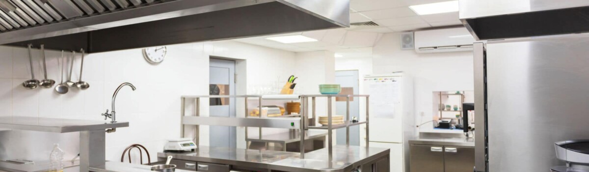 Kitchen in restaurant ensuring it is spotless to meet food hygiene practices