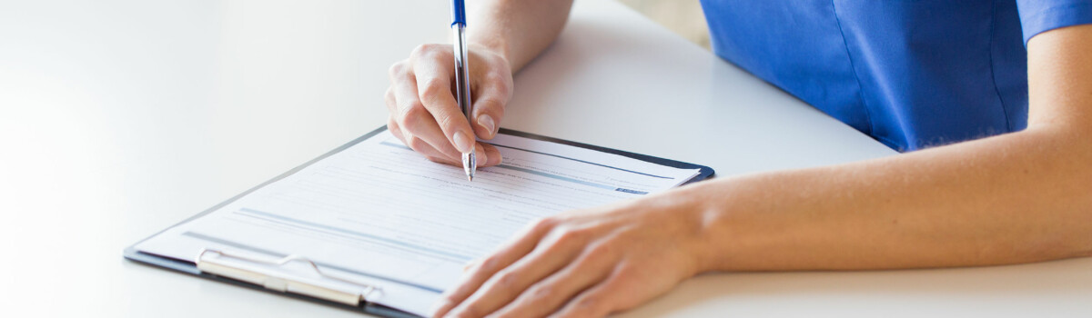 Female nurse filling out Deprivation of Liberty application in care home