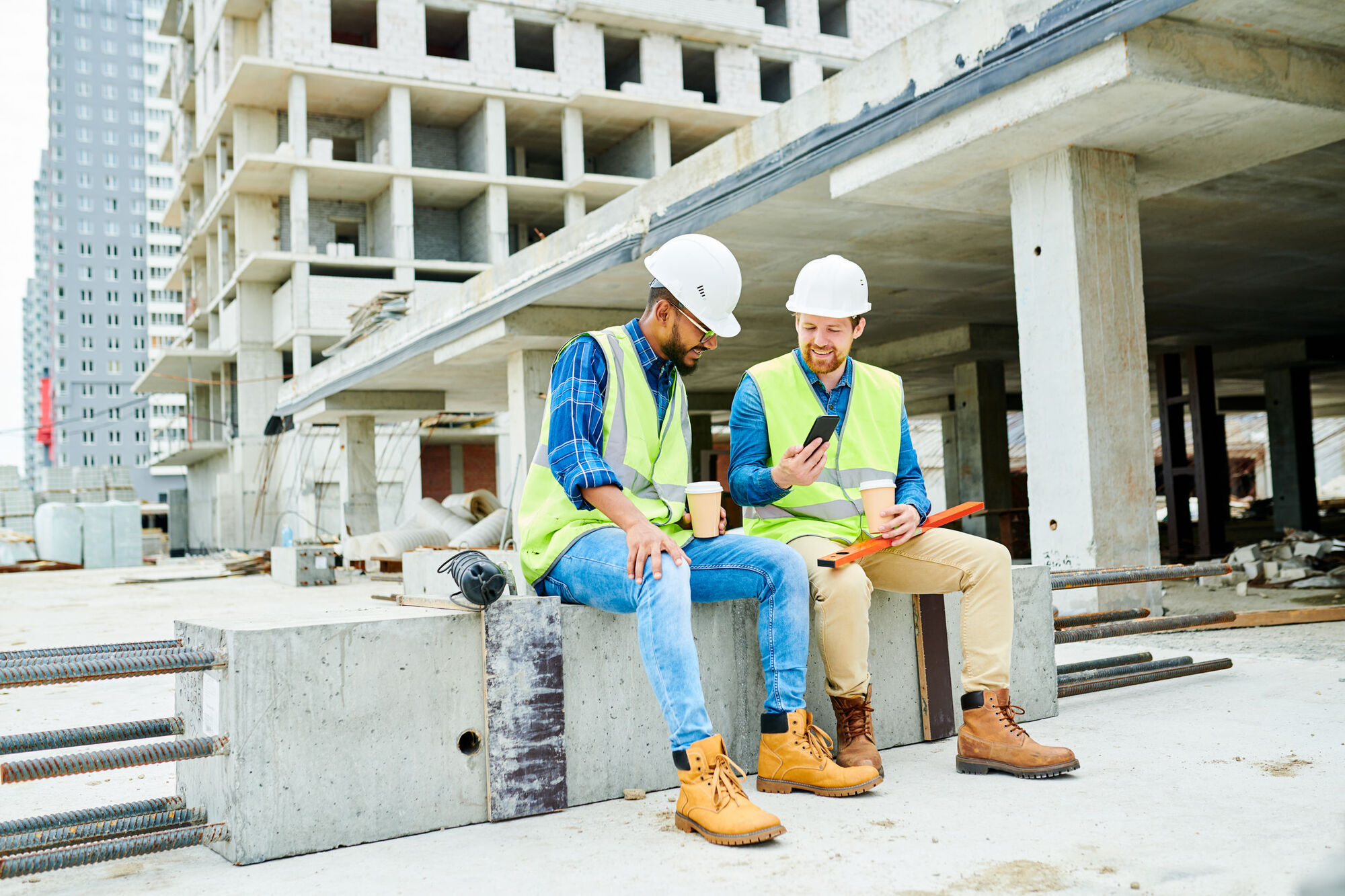 Builders discussing how to keep motivation levels up between staff Builders discussing how to keep motivation levels up between staff