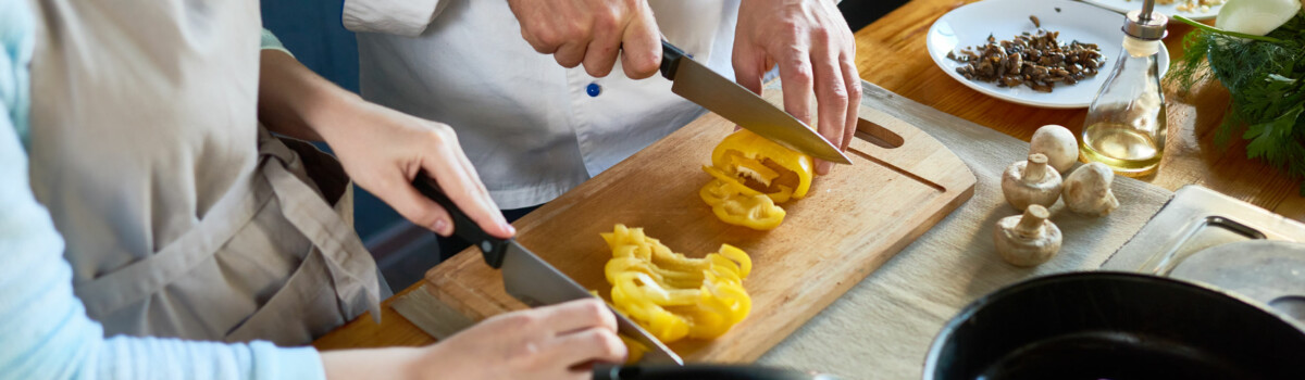 Chef cooking from home with assistant before EHO visit