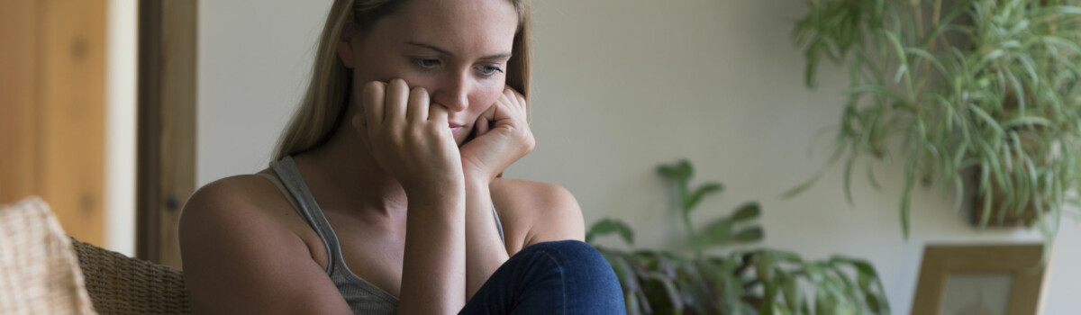 Care worker at home feeling stressed about abuse she has seen taking place