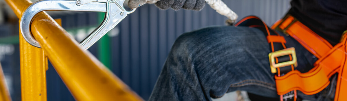 Worker who is working at height using PPE to prevent him slipping