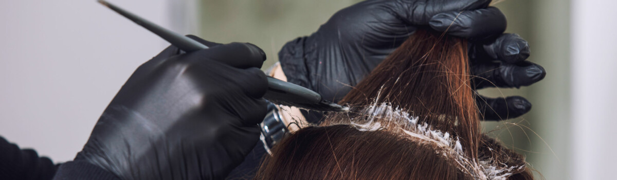 Hairdresser ensuring salon health and safety is met