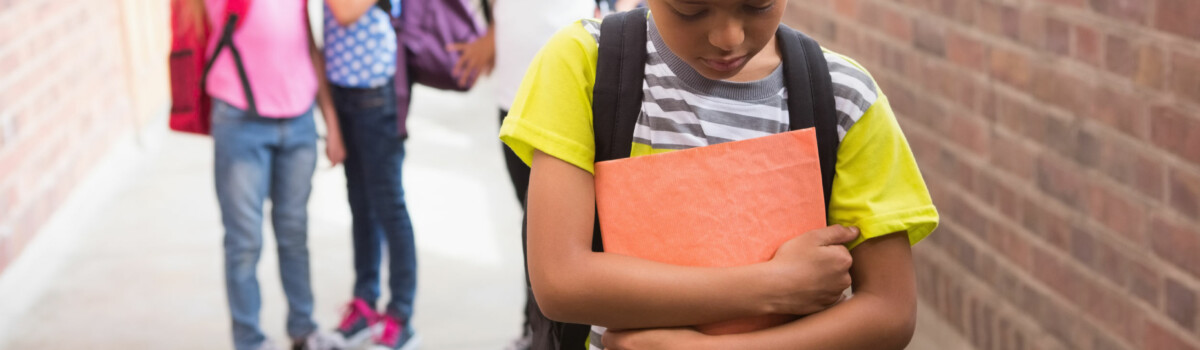 Child sad and alone at school