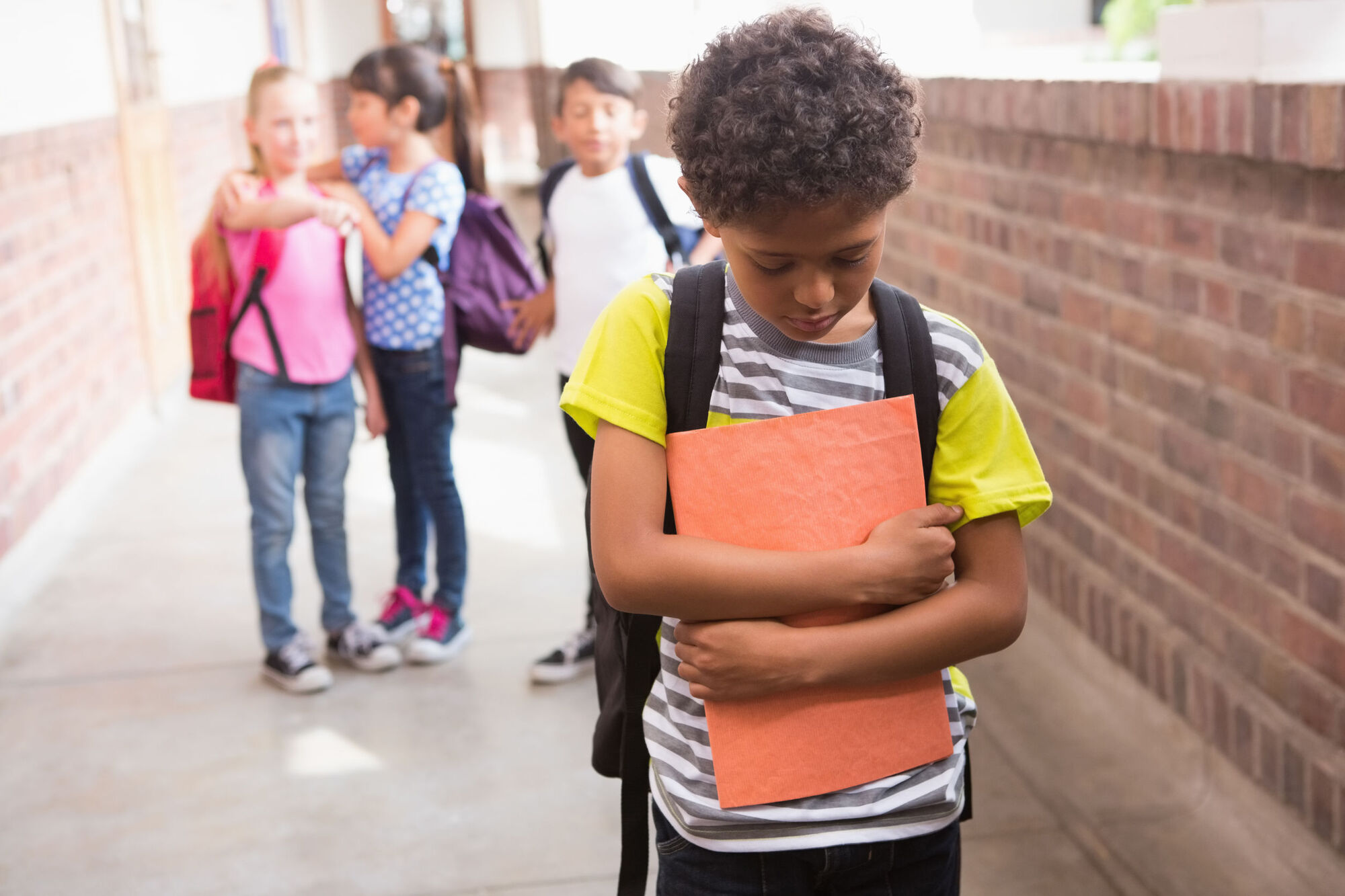 Child sad and alone at school Child sad and alone at school