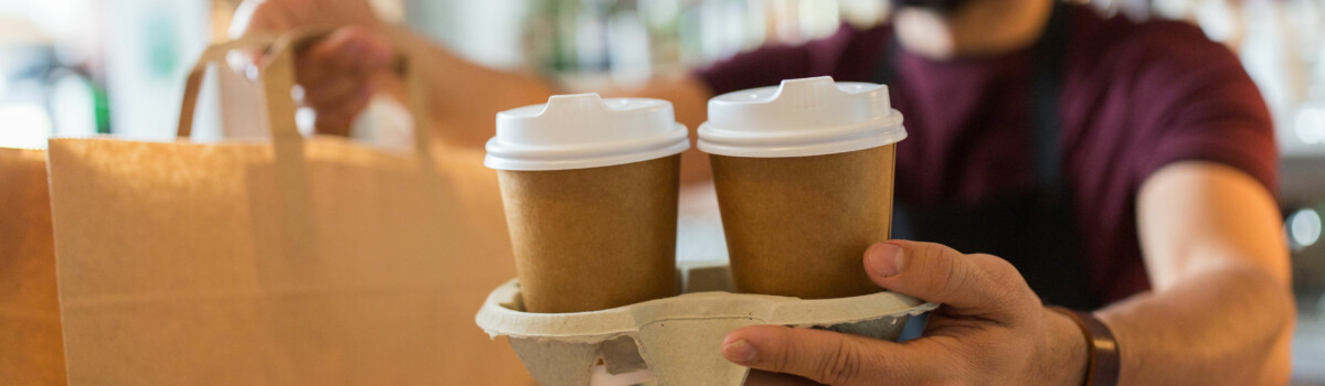 Cafe worker promoting good customer service in a cafe