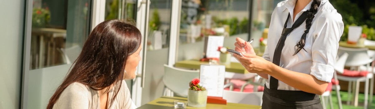 Waitress taking order from customer