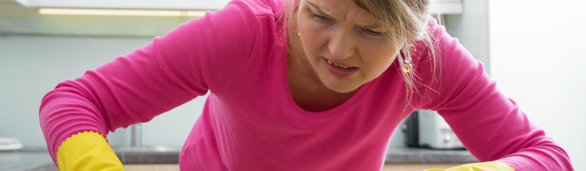 Woman with OCD cleaning the counter