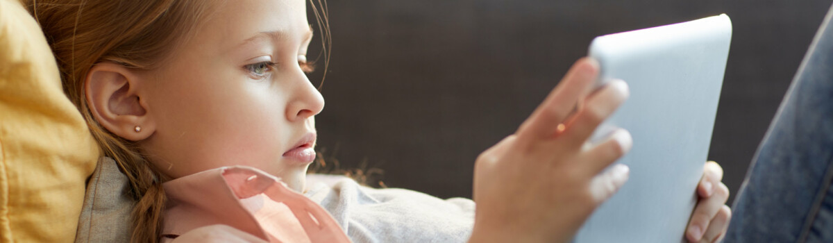 Child Watching YouTube Videos On Tablet