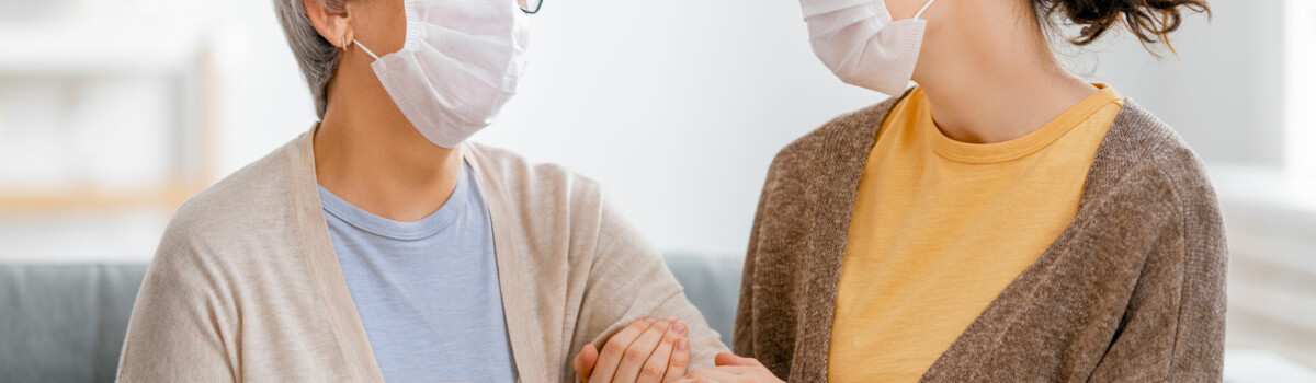 Care worker assisting vulnerable patient in the COVID-19 Pandemic