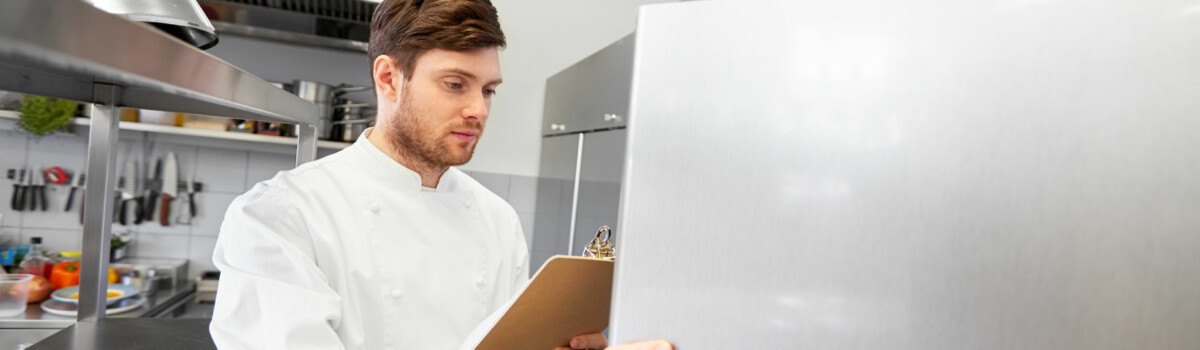 Chef stocktaking items in the fridge