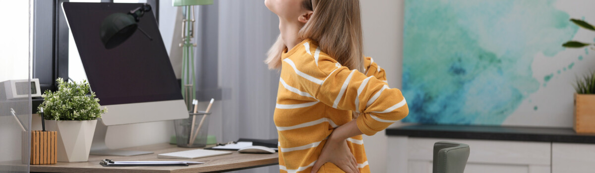 Woman struggling with back problems