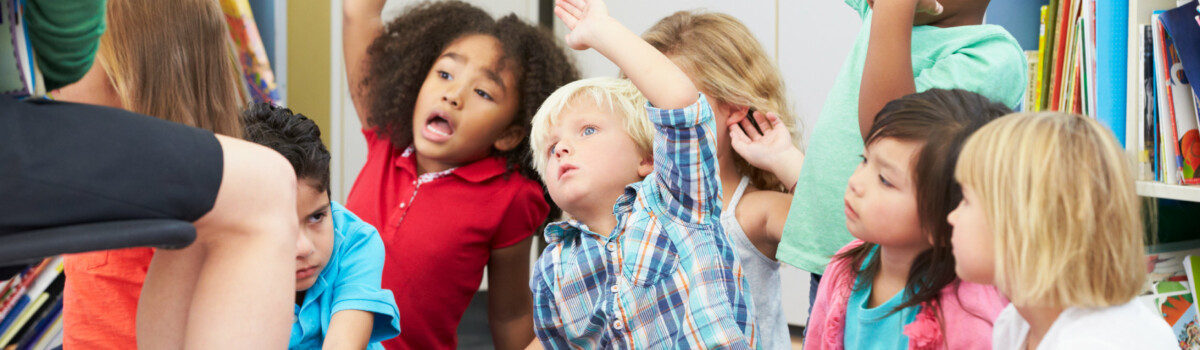 Children sat on carpet with teacher