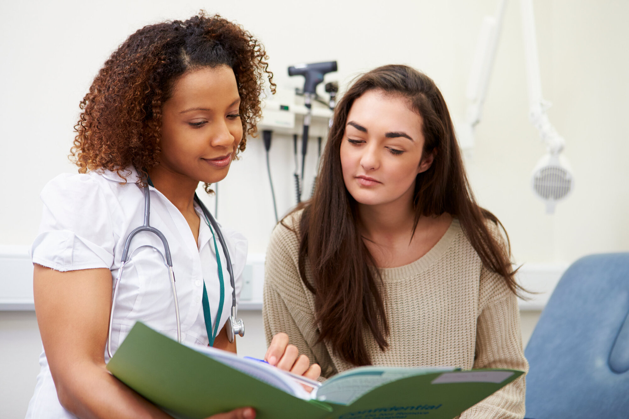 Girl in a GP appointment discussing symptoms of psychosis Girl in a GP appointment discussing symptoms of psychosis