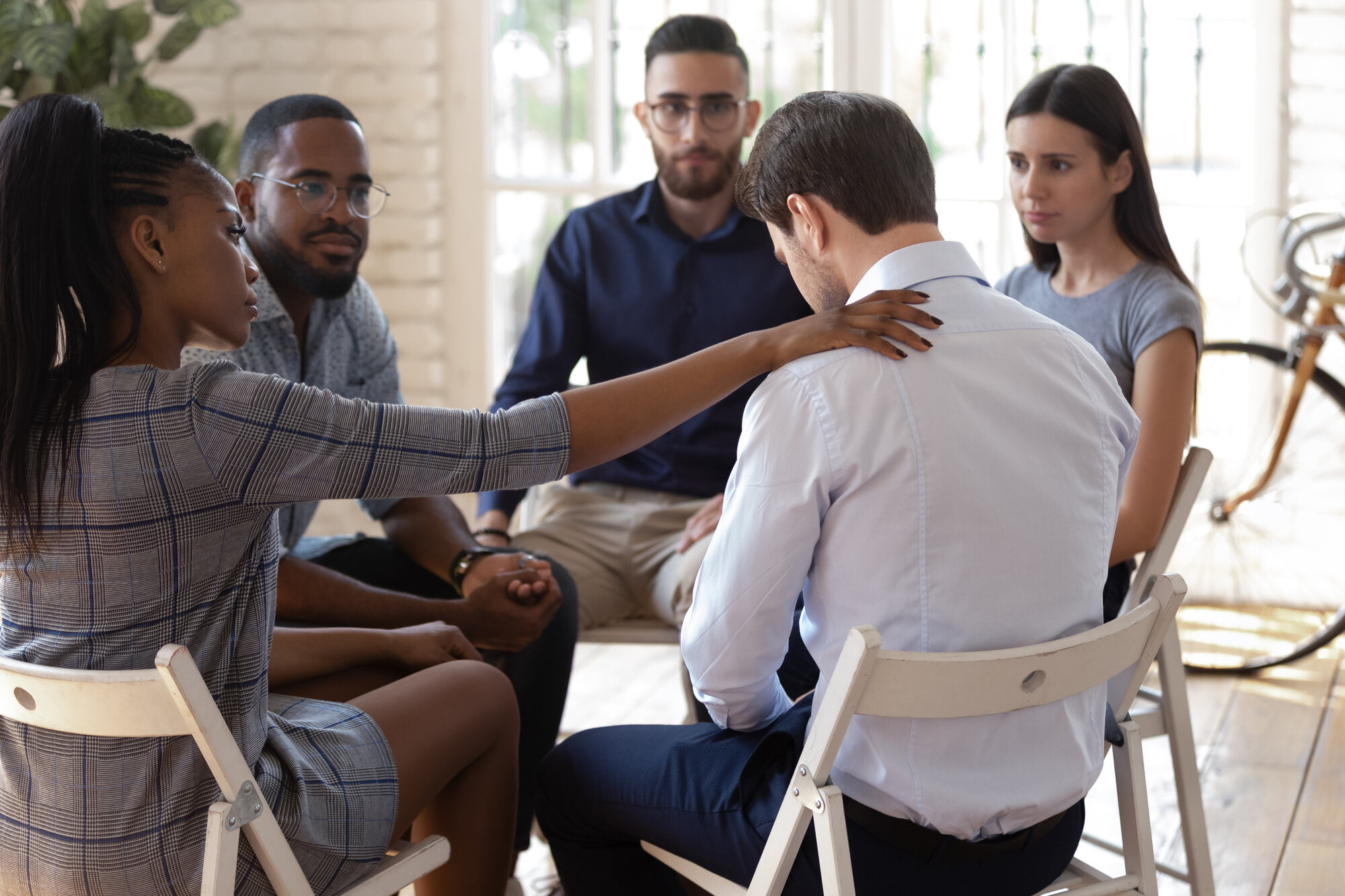 People at a self-help group to try help each other People at a self-help group to try help each other
