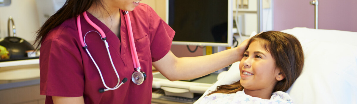 Trainee nurse volunteering in children's ward