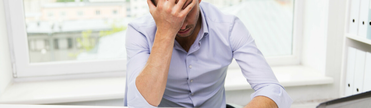 A man struggling with stress A man struggling with stress