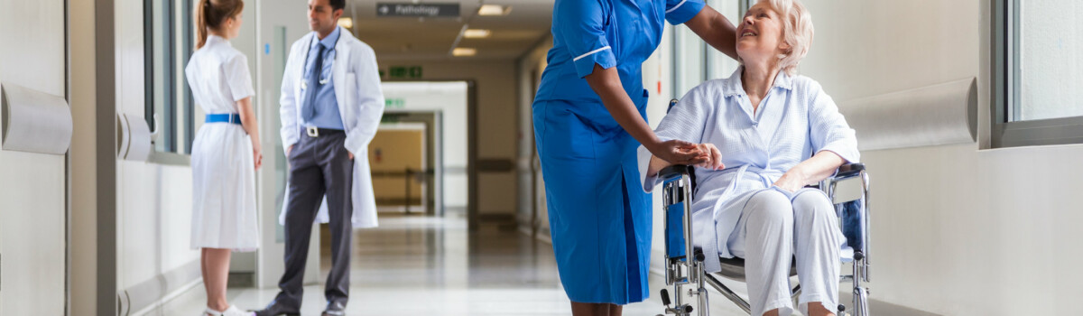 Nurse caring for her patient in hospital