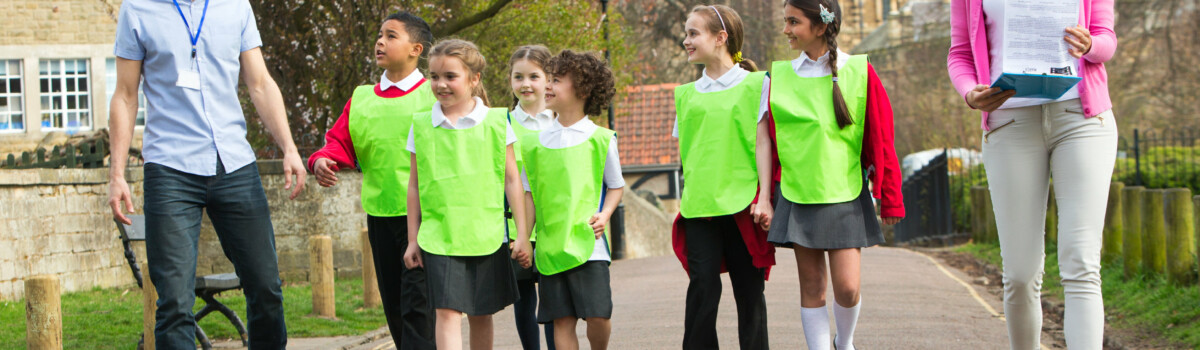 Teachers working in school in outdoor play lesson