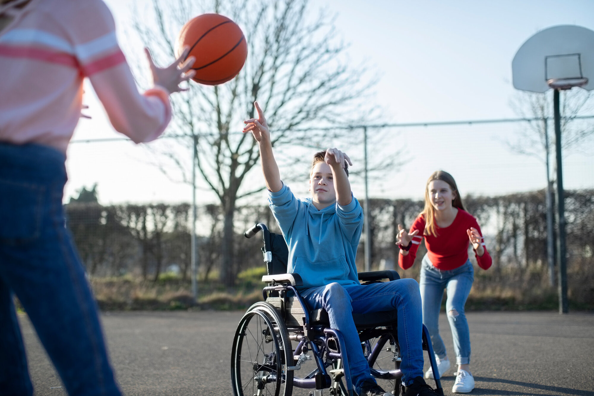 Inclusive practise being shown by group of children playing equally Inclusive practise being shown by group of children playing equally