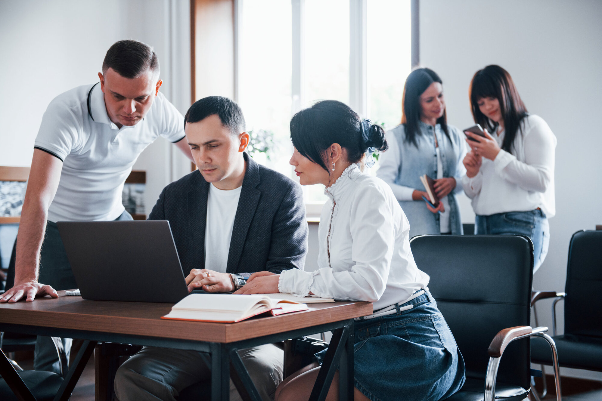 Business team working out costs Business team working out costs
