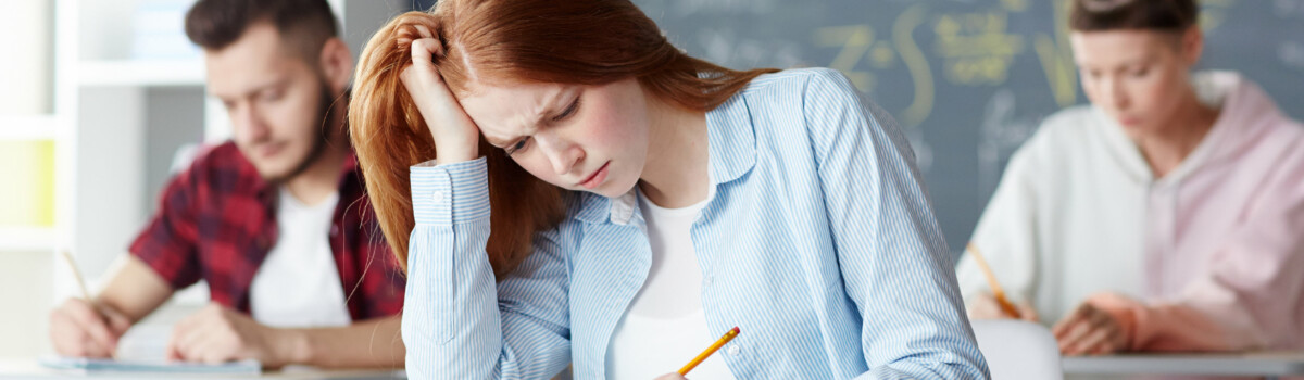 Girl with dyslexia struggling with spelling in school