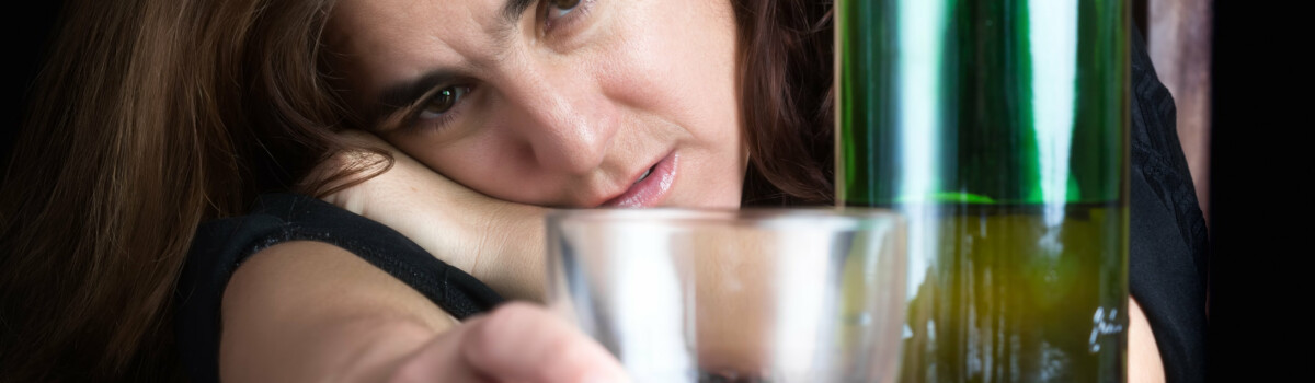 Woman struggling with alcohol addiction