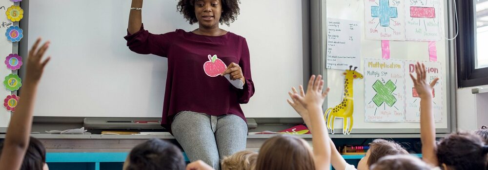 Teacher discussing mental health with children