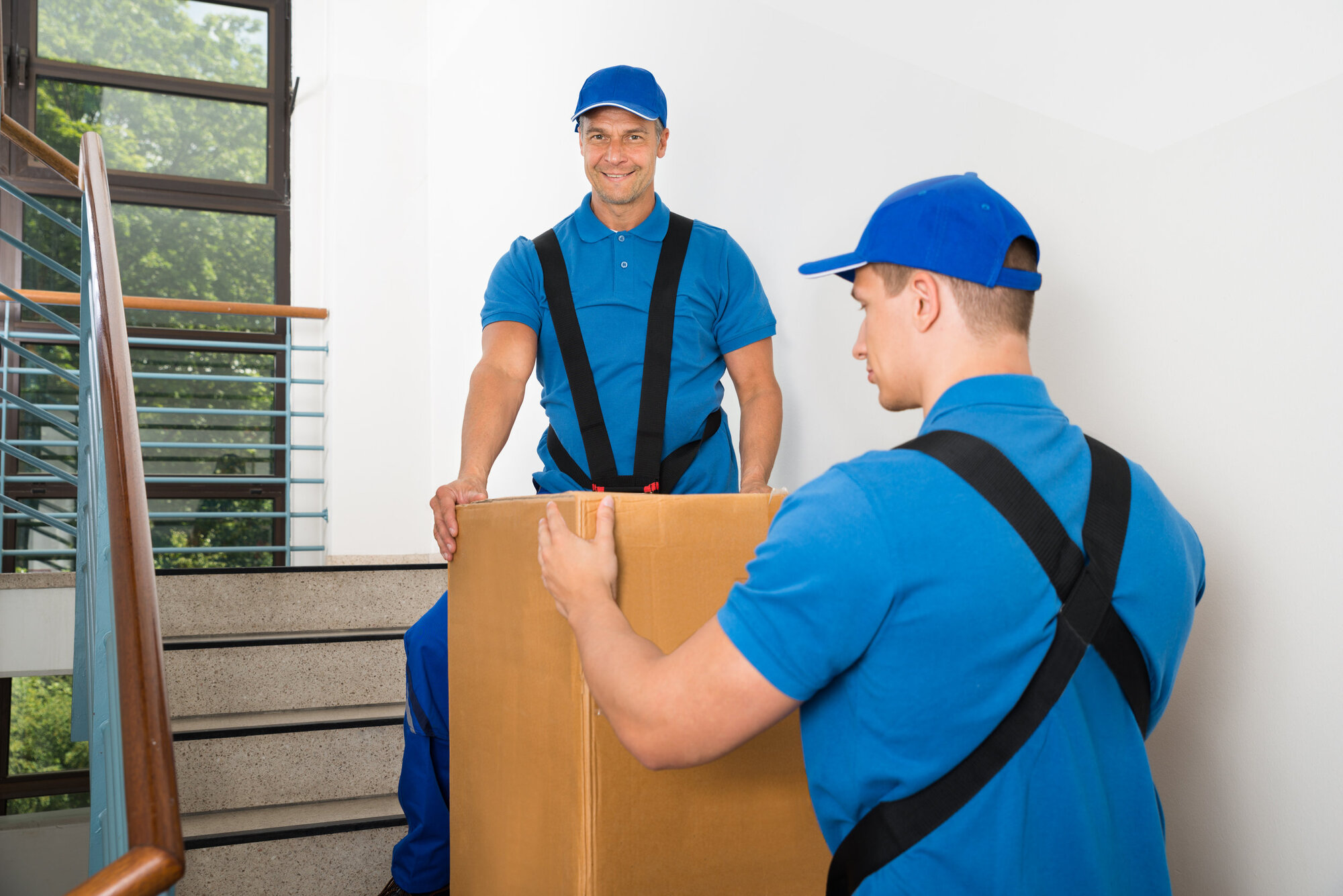 Men using TILE to carry heavy box safely Men using TILE to carry heavy box safely