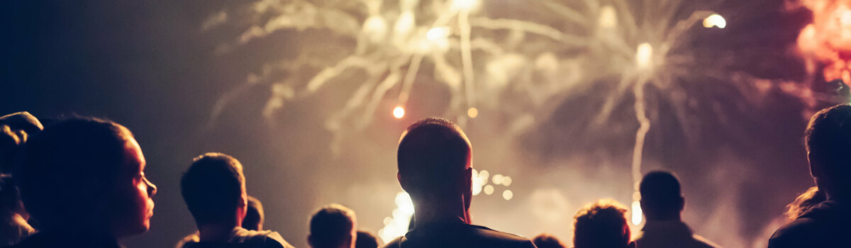 People watching firework display