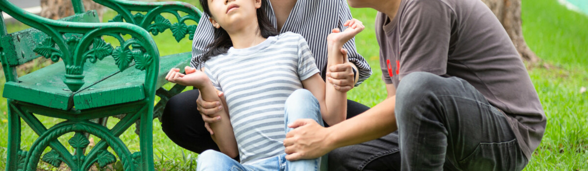 Young girl with epilepsy in school playground