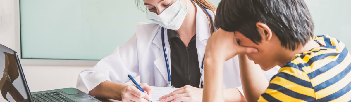 School nurse administering medication in school