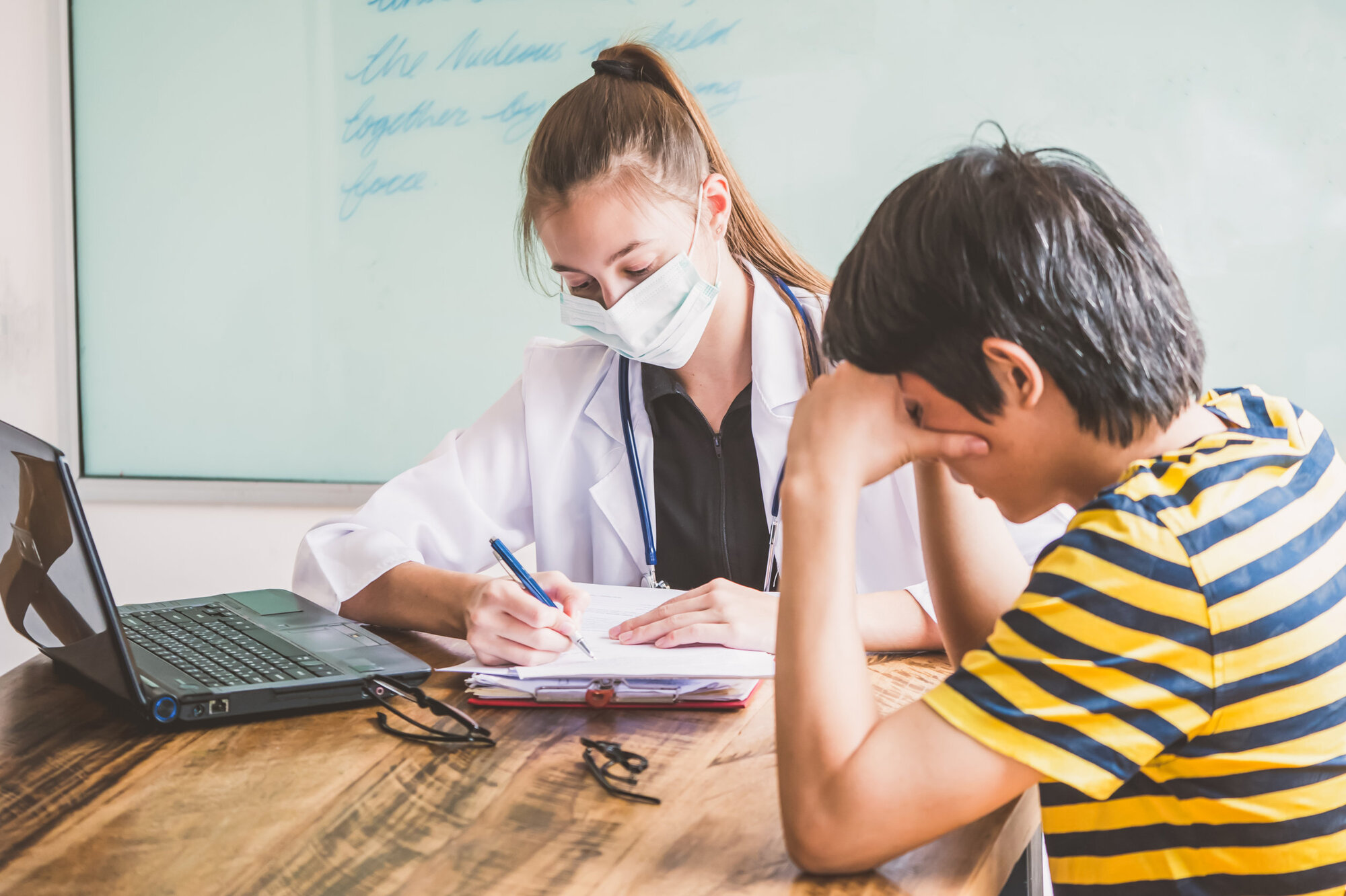 School nurse administering medication in school School nurse administering medication in school