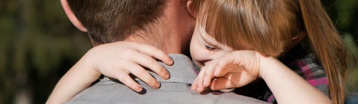 Young girl crying at the loss of a parent