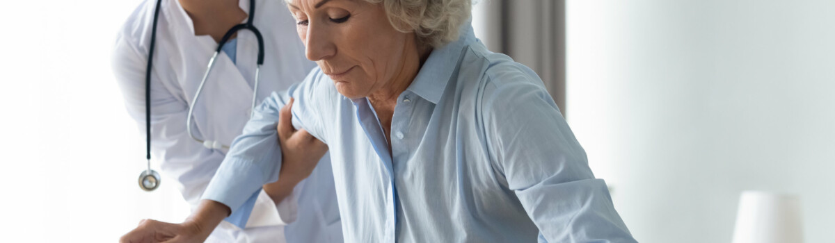 Woman in pain with doctor