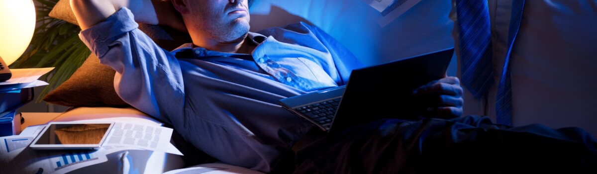 Businessman showing resilience by working late hours