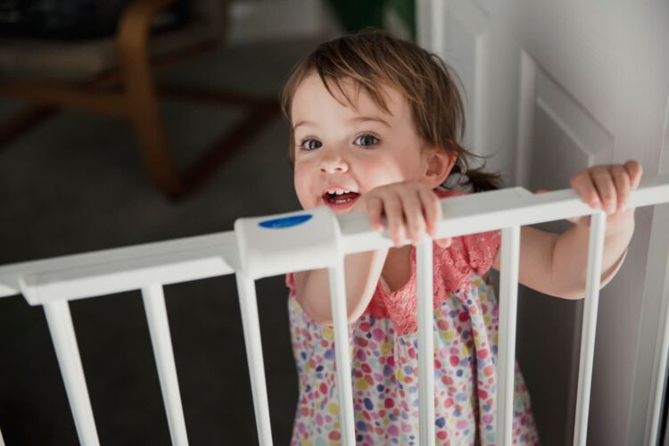 Baby safety gate in nursery