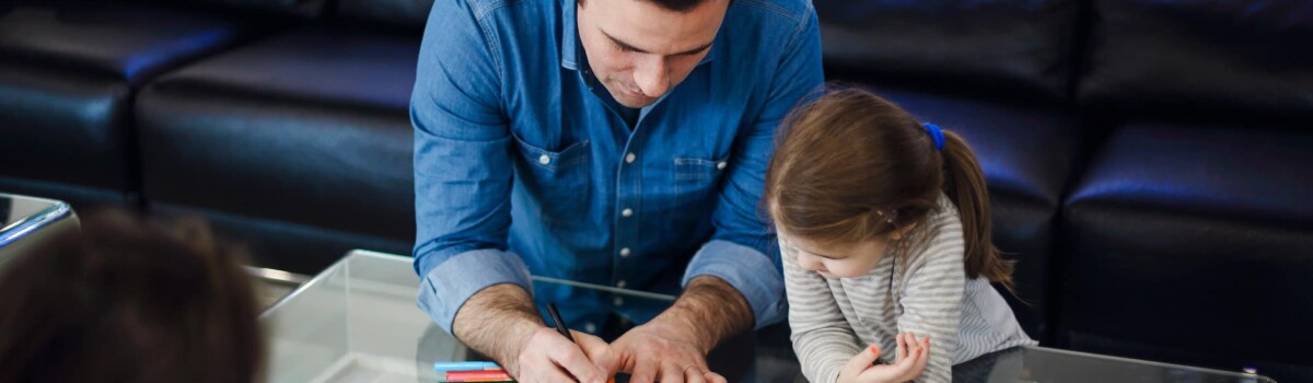 Childminder doing art with child