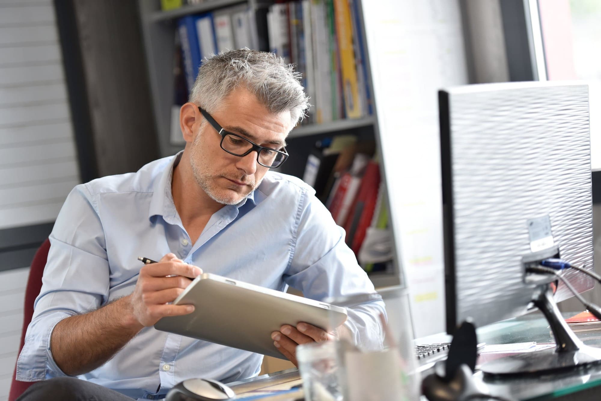 Manager of business looking at feedback Manager of business looking at feedback