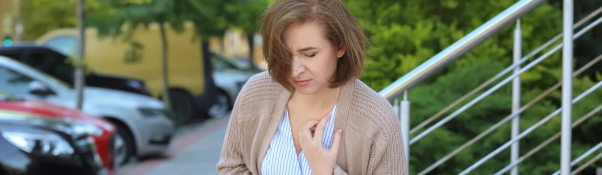 Woman having chest pain due to panic attack