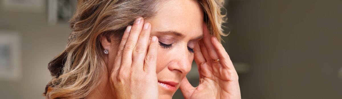 Woman suffering from migraines