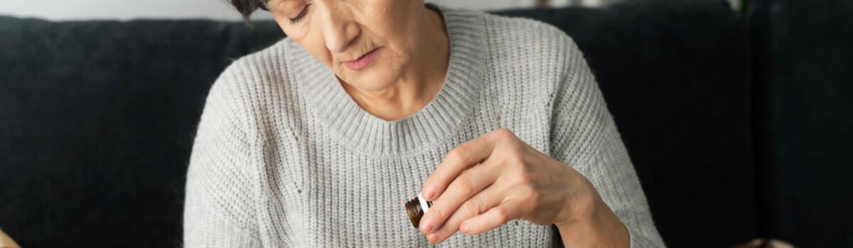 Woman taking tablet form of morphine