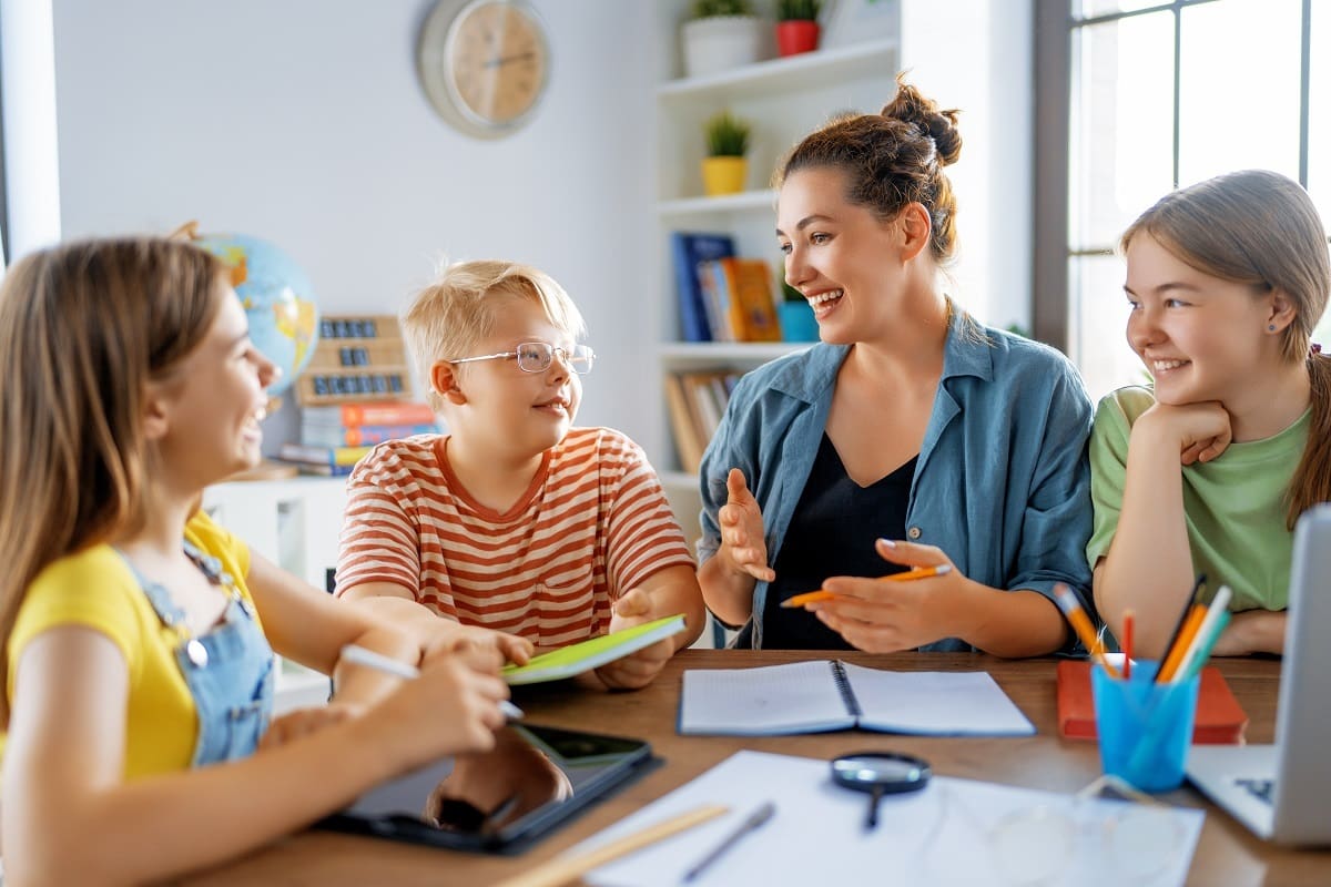 Teacher using adaptive teaching to help students Teacher using adaptive teaching to help students